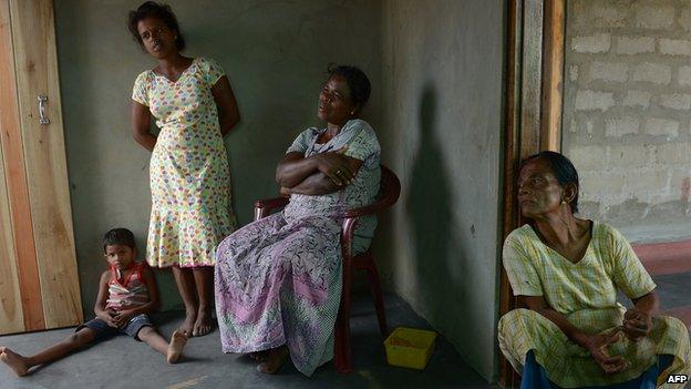 Tamil widow Vathana Baaskari and her relatives discuss the war