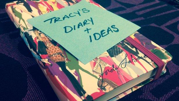 a notebook with Tracy's diary written on a post-it note