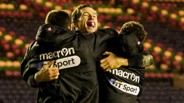 Tim Visser celebrates scoring a try for Edinburgh