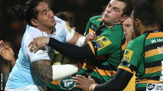 Anitelea Tuilagi of Newcastle (l) is stopped by Stephen Myler