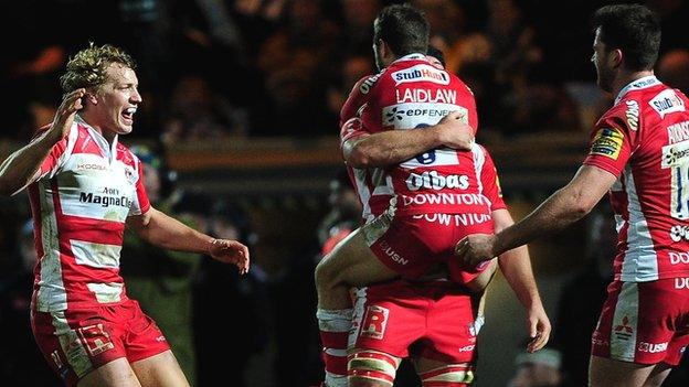 Billy Twelvetress of Gloucester (l) runs to celebrate with Mark Atkinson (far r)