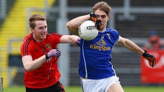 Paul Devine and Killian Clarke contend for possession as Cavan beat Down at Pairc Esler