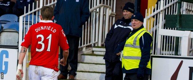 Ross County midfielder Terry Dunfield makes his way up the tunnel after being sent off early in the match