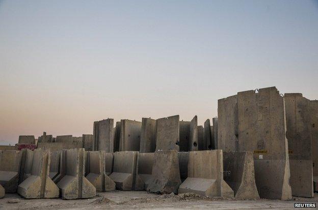 Blast barriers stand in a yard at Bagram air base, 1 January