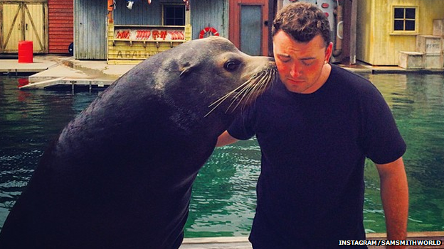 Sam Smith with a seal