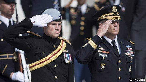 Prince Harry and Major General Michael S Linnington saluting