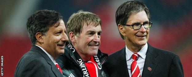 John Henry (right) with Liverpool legend Kenny Dalglish (centre)