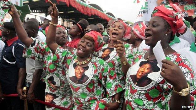 Supporters of Nigeria's President Goodluck Jonathan react during his declaration to seeking a second term in the February 2015 presidential election, in Abuja on 11 November 2014