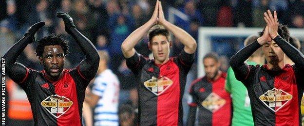 Wilfried Bony [L] with Federico Fernandez [C] and Ki Sung-Yueng [R]