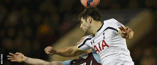 Federico Fazio beats Ashley Barnes to a header