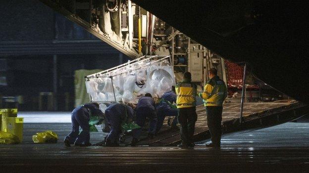 Ms Cafferkey being taken into RAF Hercules at