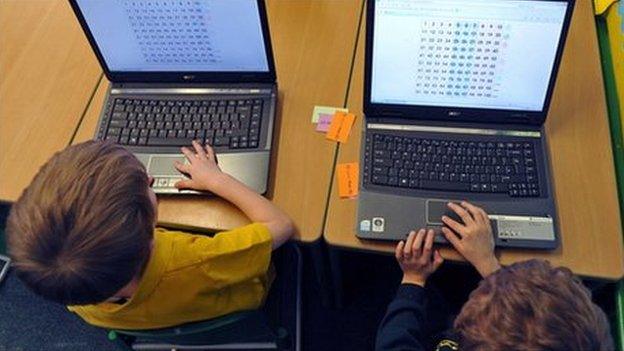 School children with laptops