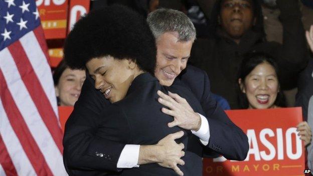 De Blasio and son Dante hug at the mayoral election victory