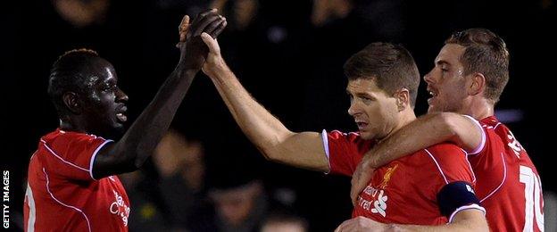 Steven Gerrard (centre) celebrates scoring against AFC Wimbledon