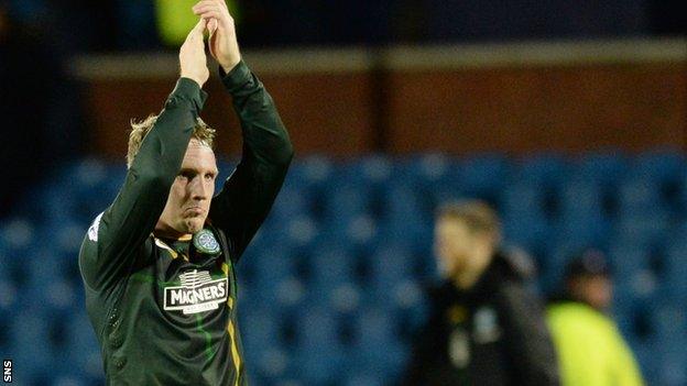 Kris Commons applauds the Celtic fans at Rugby Park