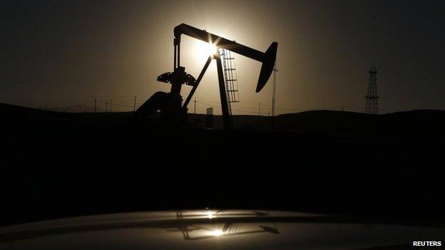 A pump jack is seen at sunrise near Bakersfield, California