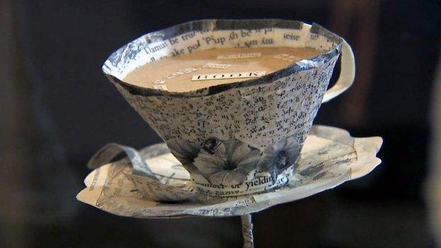 Paper sculpture of a teacup and saucer