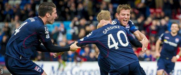 Richie Brittain celebrates with team-mates Rocco Quinn and Michael Gardyne