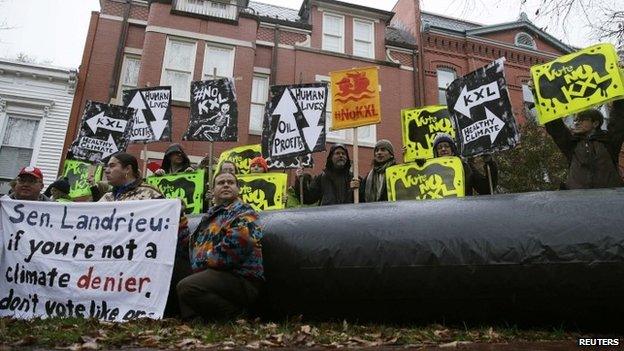 Climate advocates and representatives from the Rosebud Sioux Tribe protest against the Keystone XL pipeline 17 November 2014