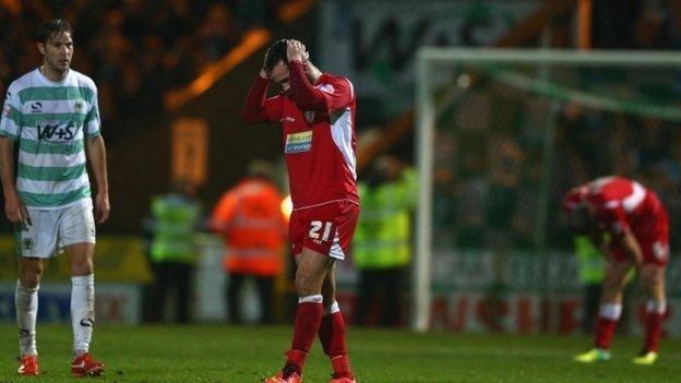 Lee Molyneux of Accrington with Samuel Foley of Yeovil