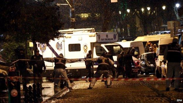 Turkish forensic officers inspect the area after an attack by a suicide bomber in front of a police station at Ottoman era near Hagia Sophia Museum in Istanbul, Turkey, 6 January 2015.