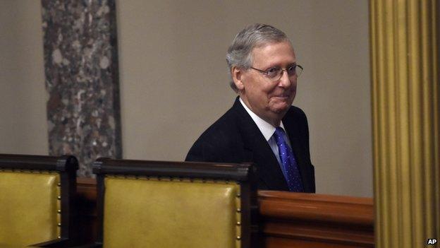 Senate Majority Leader Mitch McConnell of Ky. smiles following his ceremonial re-enactment swearing-in ceremony, Tuesday, Jan. 6, 2015,