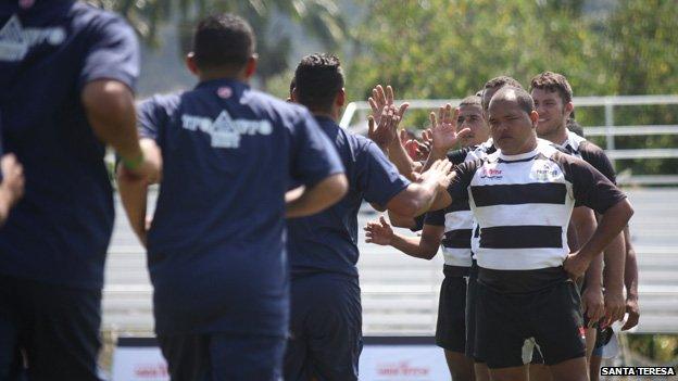 Players of Project Alcatraz and Tocoron meet on the pitch