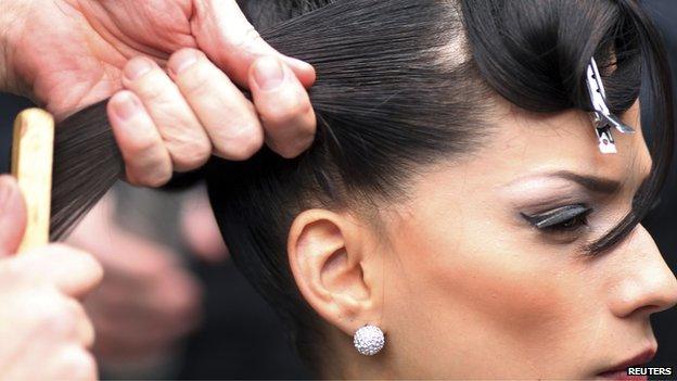 Lady getting her haircut