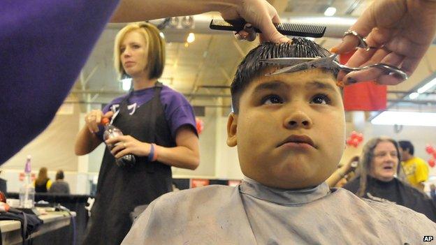 Young boy getting his haircut