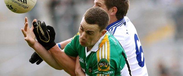 Niall McNamee (in green) jumps for a high ball playing for Offaly