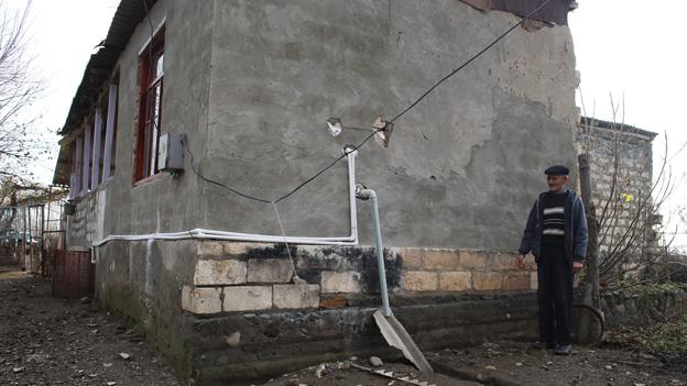 Shrapnel-damaged wall in Gazyan