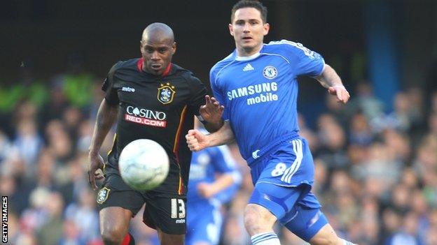 Huddersfield's Frank Sinclair comes up against Frank Lampard of Chelsea in an FA Cup tie in 2008