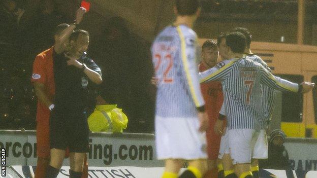 Referee Willie Collum sent Kenny McLean off on a miserable wet day in Paisley