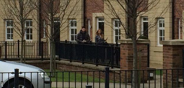 Ched Evans leaves his Cheshire home with girlfriend Natasha Massey