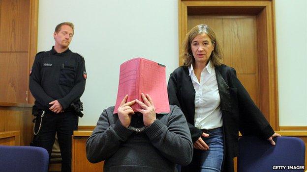 Niels H. arrives for his trial at court on November 27, 2014 in Oldenburg, Germany.