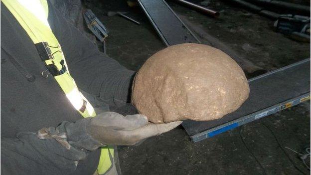 A large stone cannonball fragment which was found at Caernarfon Castle