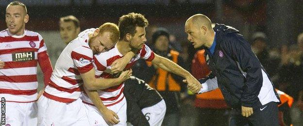 Alex Neil passes on instructions to Hamilton's top-scorer Tony Andreu after a goal