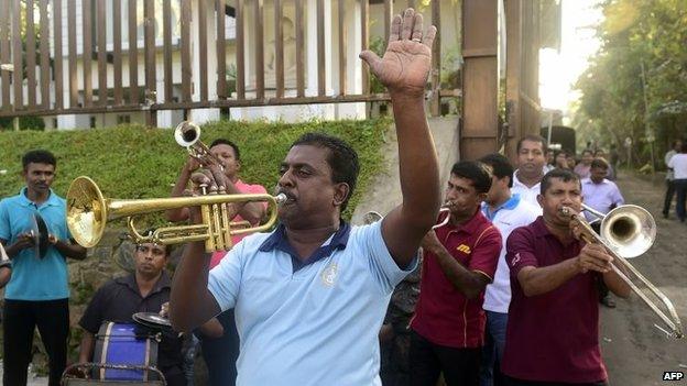 Supporters of Sri Lanka's main opposition candidate Maithripala Sirisena play music as they celebrate in the streets of Colombo after Sri Lanka"s President Mahinda Rajapaksa conceded defeat on January 9