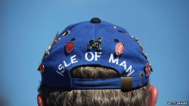 A man wearing an Isle of Man hat