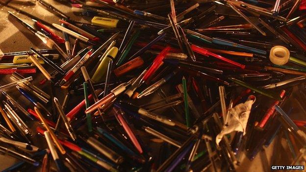 A pile of pens left by mourners