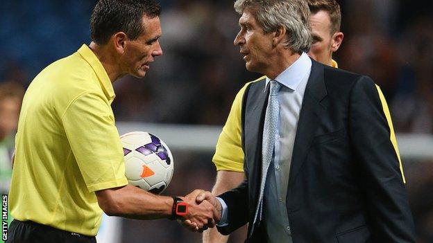 Andre Marriner and Manuel Pellegrini