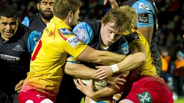 Glasgow's Jonny Gray is held up by the Scarlets defence