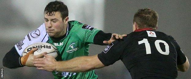 Robbie Henshaw tries to hand off Greig Tonks in Galway