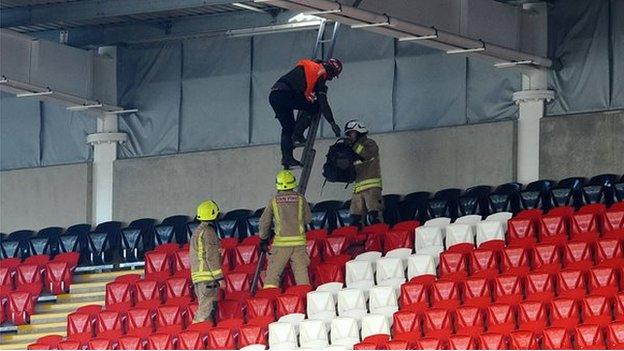 Firefighters repair damage to Cardiff City stadium roof after wind damage