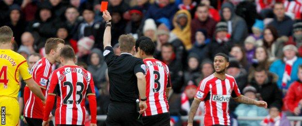 Sunderland midfielder Liam Bridcutt (right) is sent off for his second booking against Liverpool