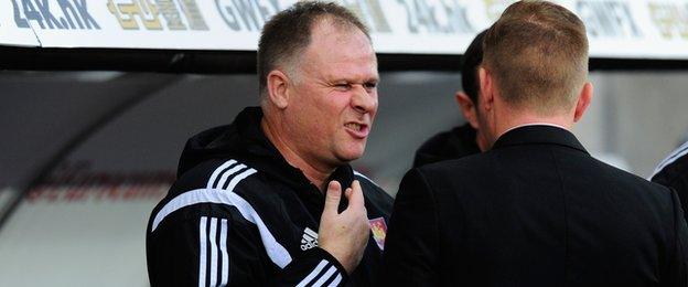 West Ham assistant manager Neil McDonald meets Swansea's Garry Monk