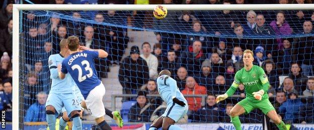 Everton defender Seamus Coleman watches as his shot hits the Manchester city crossbar