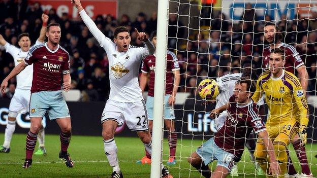 Swansea celebrate a goal against West Ham