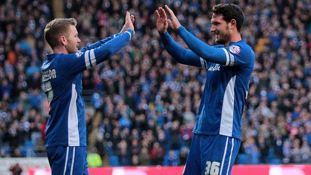 Aron Gunnarsson (L) congratulates Cardiff goal-scorer Sean Morrison