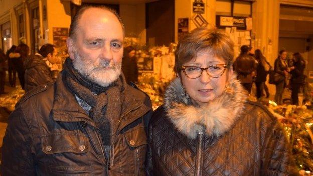 Lille couple at the vigil near the offices of Charlie Hebdo, on Rue Nicolas Appert, Paris. Photo taken 11 January, by Patrick Jackson, BBC News